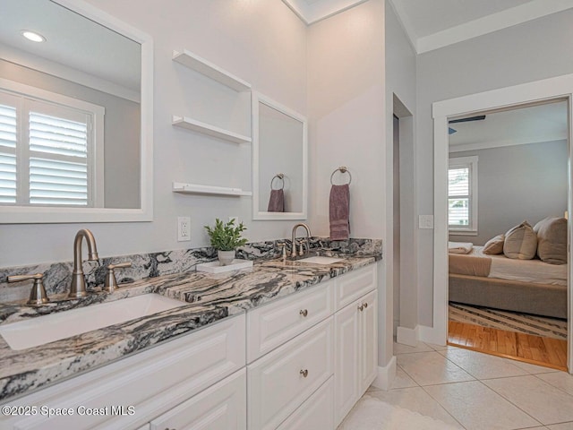 406 9th Ct, Vero Beach, FL 32962 - ensuite bathroom with double vanity, tile patterned flooring, crown molding, and recessed lighting