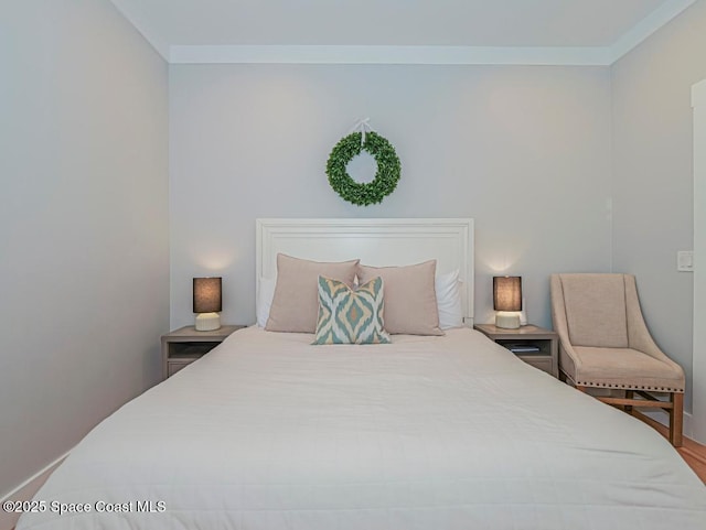406 9th Ct, Vero Beach, FL 32962 - bedroom with wood finished floors and ornamental molding