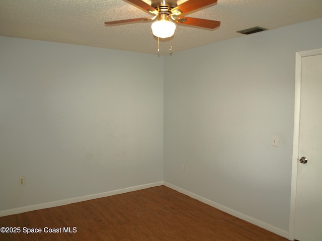 292 San Juan Cir, Melbourne, FL 32935 - spare room with wood finished floors, a ceiling fan, and a textured ceiling