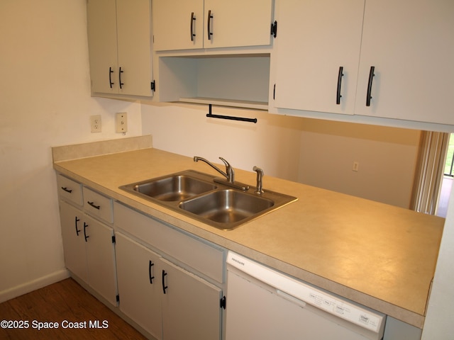 292 San Juan Cir, Melbourne, FL 32935 - kitchen with white dishwasher, light countertops, and wood finished floors