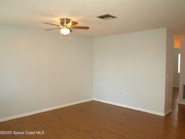 292 San Juan Cir, Melbourne, FL 32935 - empty room with a ceiling fan, wood finished floors, and a textured ceiling