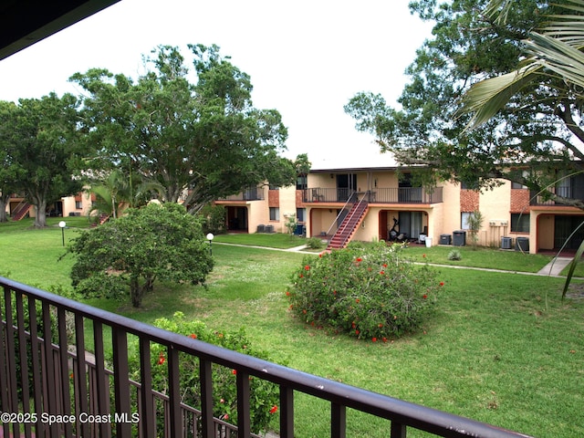 292 San Juan Cir, Melbourne, FL 32935 - view of property's community with a yard and stairs