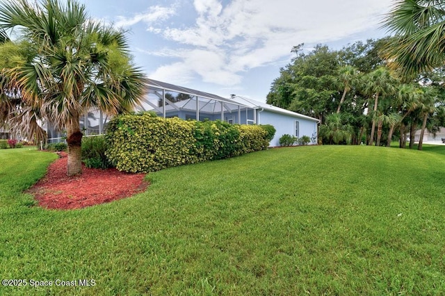 770 S Easy St, Sebastian, FL 32958 - view of green lawn with a lanai