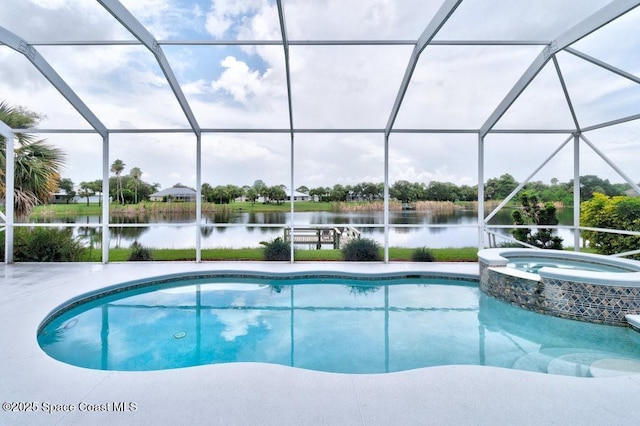 770 S Easy St, Sebastian, FL 32958 - view of pool featuring a water view, glass enclosure, a pool with connected hot tub, and a patio