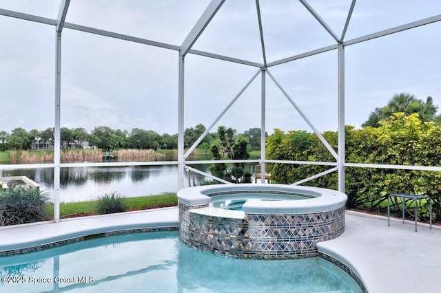 770 S Easy St, Sebastian, FL 32958 - view of pool featuring a water view, a lanai, and a pool with connected hot tub