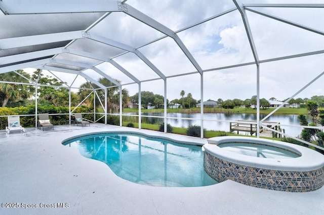 770 S Easy St, Sebastian, FL 32958 - view of swimming pool with a patio, a water view, a pool with connected hot tub, and a lanai