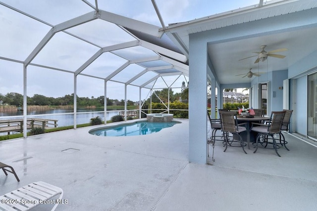 770 S Easy St, Sebastian, FL 32958 - view of swimming pool featuring a water view, a patio, a ceiling fan, a pool with connected hot tub, and a lanai