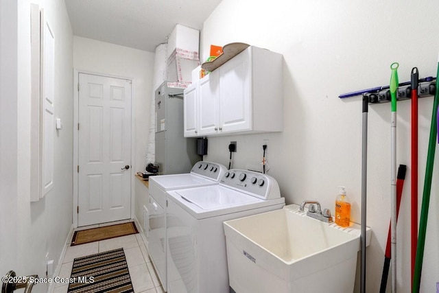 770 S Easy St, Sebastian, FL 32958 - laundry area with cabinet space, separate washer and dryer, and light tile patterned floors