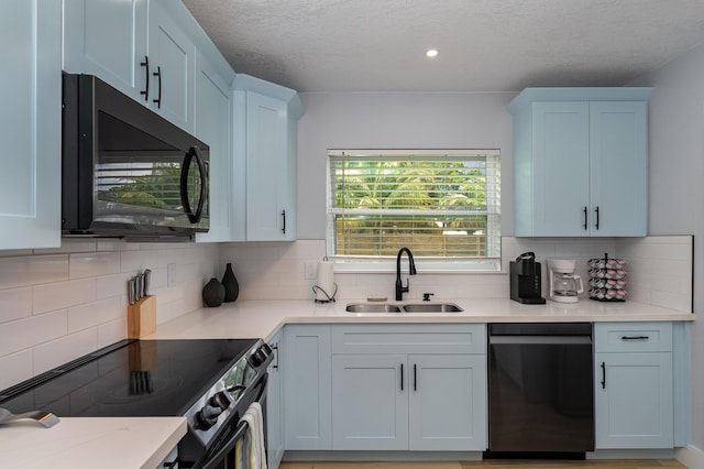 131 W Gadsden Ln, Cocoa Beach, FL 32931 - kitchen with dishwashing machine, black microwave, range with electric stovetop, decorative backsplash, and recessed lighting