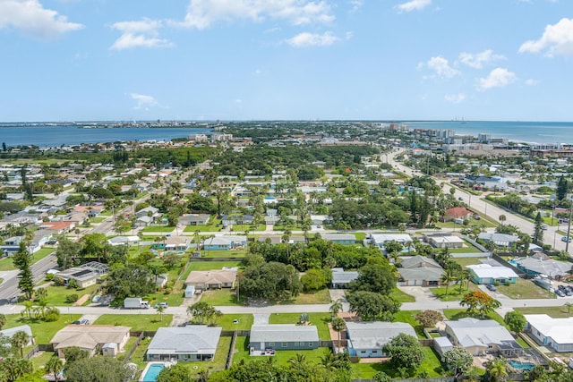 131 W Gadsden Ln, Cocoa Beach, FL 32931 - aerial view of property and surrounding area featuring a large body of water and nearby suburban area