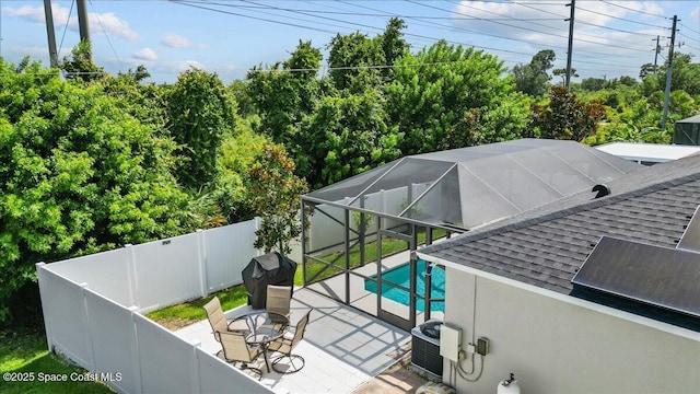 1787 Attilburgh Blvd, West Melbourne, FL 32904 - swimming pool with a fenced backyard, a patio, area for grilling, and glass enclosure