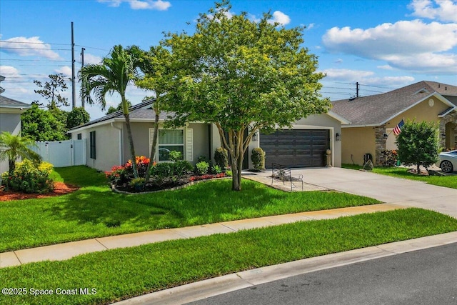 1787 Attilburgh Blvd, West Melbourne, FL 32904 - view of front of home with stucco siding, concrete driveway, and an attached garage