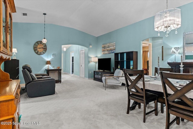1787 Attilburgh Blvd, West Melbourne, FL 32904 - dining area featuring arched walkways, carpet flooring, a chandelier, and high vaulted ceiling