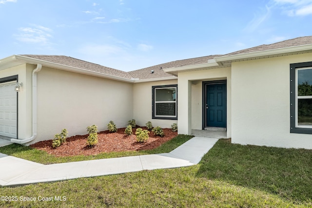 960 Hanson Ave SW, Palm Bay, FL 32908 - entrance to property featuring stucco siding, an attached garage, a shingled roof, and a lawn