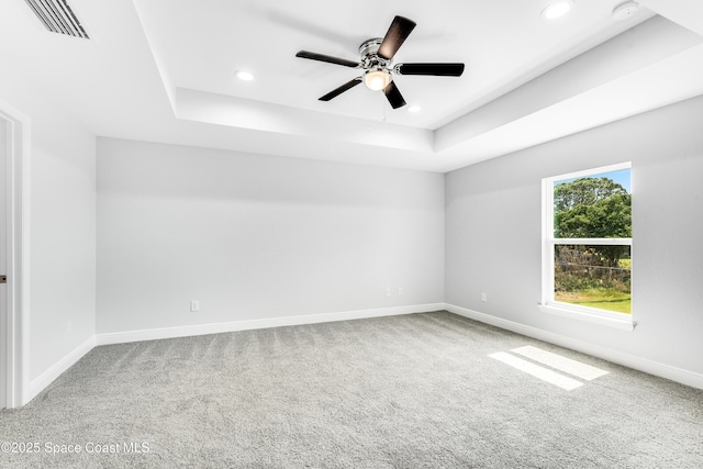 2181 Wagonwheel Ave SE, Palm Bay, FL 32909 - carpeted spare room featuring a raised ceiling, a smoke detector, recessed lighting, and a ceiling fan