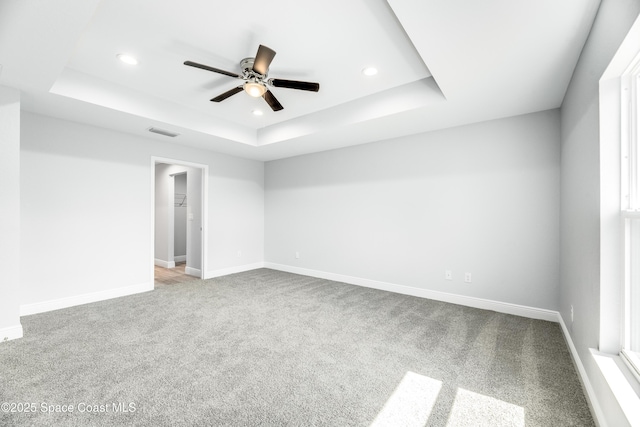 2181 Wagonwheel Ave SE, Palm Bay, FL 32909 - carpeted empty room with a raised ceiling, a ceiling fan, and recessed lighting