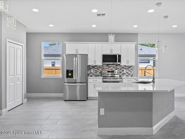 3358 Nancy St, West Melbourne, FL 32904 - kitchen featuring stainless steel appliances, white cabinetry, backsplash, light countertops, and recessed lighting