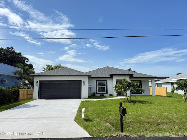 3358 Nancy St, West Melbourne, FL 32904 - prairie-style home featuring stucco siding, an attached garage, driveway, and roof with shingles