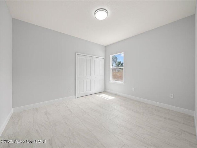 3358 Nancy St, West Melbourne, FL 32904 - unfurnished bedroom with a closet and baseboards