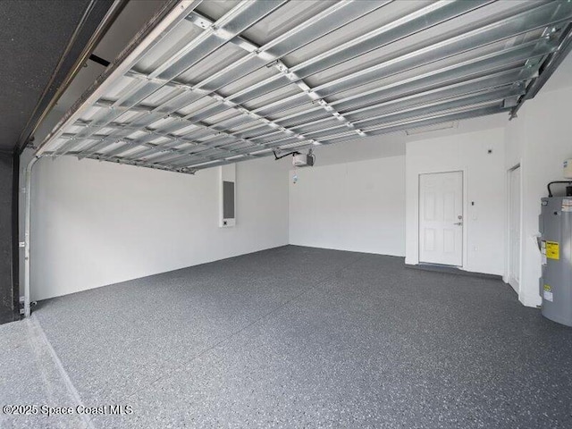 3358 Nancy St, West Melbourne, FL 32904 - garage featuring electric water heater, a garage door opener, and electric panel