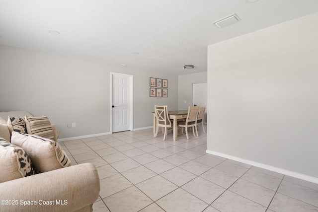 845 Westport Dr, Rockledge, FL 32955 - living area with light tile patterned floors and baseboards