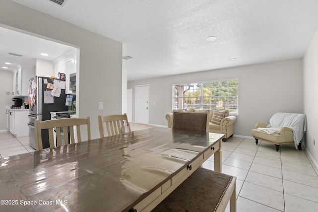 845 Westport Dr, Rockledge, FL 32955 - dining room with light tile patterned floors, recessed lighting, and a textured ceiling