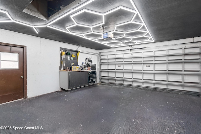 845 Westport Dr, Rockledge, FL 32955 - garage with a garage door opener and a workshop area