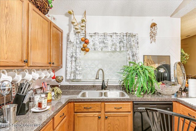 2595 Diane Ave SE, Palm Bay, FL 32909 - kitchen with black dishwasher, a textured ceiling, and a fireplace