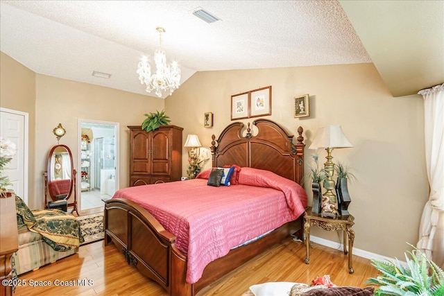 2595 Diane Ave SE, Palm Bay, FL 32909 - bedroom featuring vaulted ceiling, a chandelier, and light wood-style floors