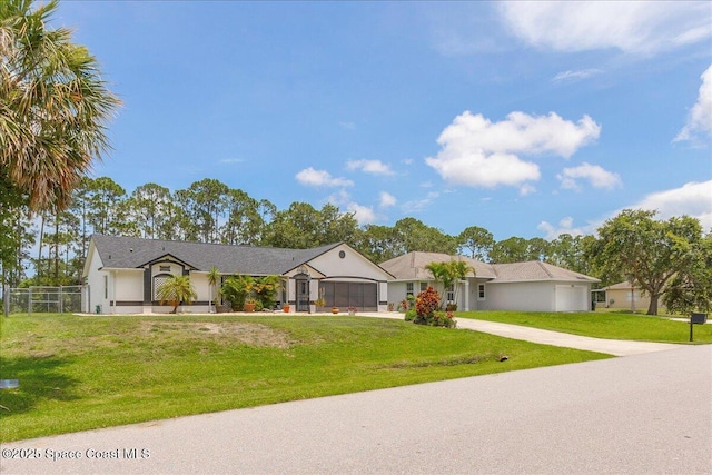 2595 Diane Ave SE, Palm Bay, FL 32909 - ranch-style house featuring an attached garage and concrete driveway