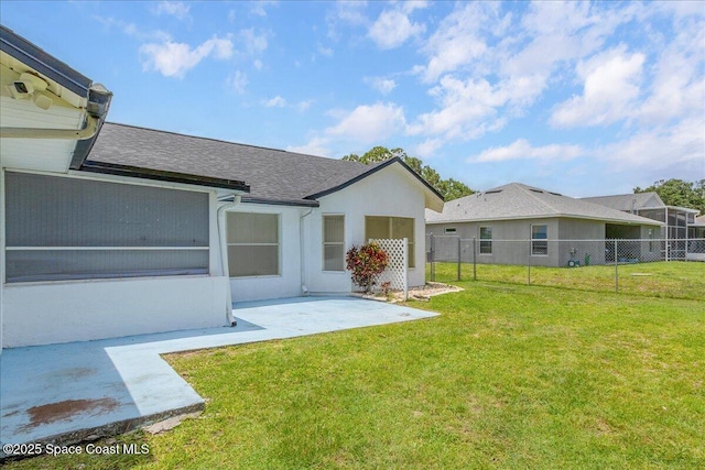 2595 Diane Ave SE, Palm Bay, FL 32909 - back of property with a patio area, a shingled roof, and stucco siding
