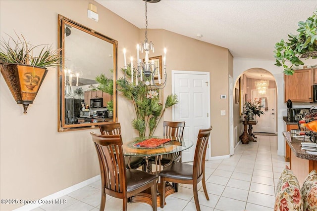 2595 Diane Ave SE, Palm Bay, FL 32909 - dining area featuring a chandelier, arched walkways, light tile patterned floors, and a textured ceiling