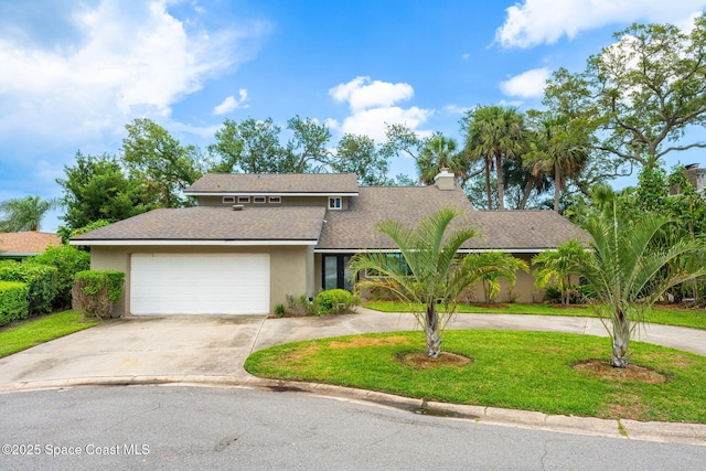 1379 Rose Ct, Melbourne, FL 32935 - mid-century home with curved driveway, stucco siding, an attached garage, a front lawn, and a shingled roof
