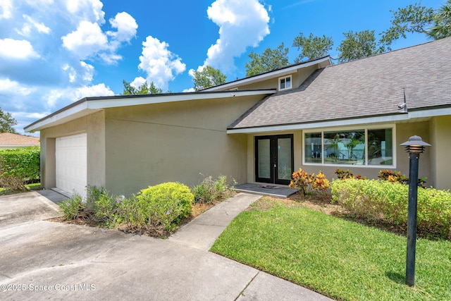 1379 Rose Ct, Melbourne, FL 32935 - view of front of property featuring french doors, a shingled roof, a front lawn, and stucco siding