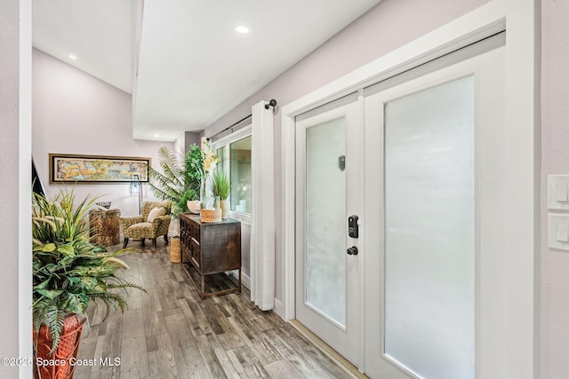 1379 Rose Ct, Melbourne, FL 32935 - foyer entrance with light wood finished floors and recessed lighting