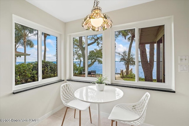 1379 Rose Ct, Melbourne, FL 32935 - dining space featuring a water view and tile patterned floors