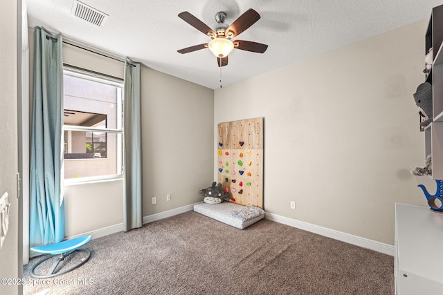 2920 Casterton Dr, Melbourne, FL 32940 - spare room with carpet floors, a ceiling fan, and a textured ceiling