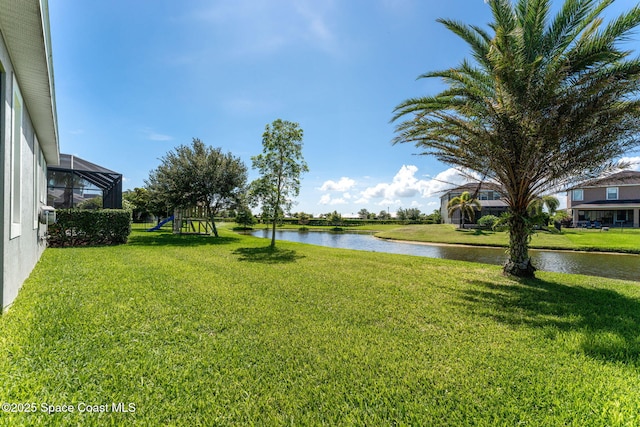 2920 Casterton Dr, Melbourne, FL 32940 - view of grassy yard featuring a water view and a playground