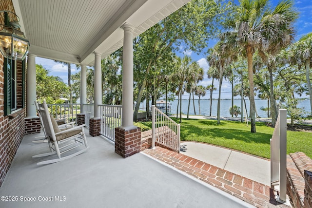 1407 Rockledge Dr, Rockledge, FL 32955 - porch with a water view and a lawn