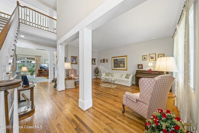 1407 Rockledge Dr, Rockledge, FL 32955 - foyer entrance with ornamental molding, light wood-style floors, and decorative columns