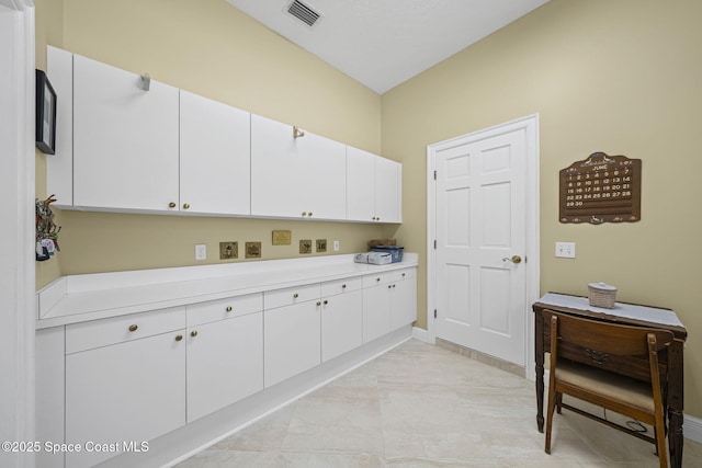 1407 Rockledge Dr, Rockledge, FL 32955 - kitchen with light countertops and white cabinetry