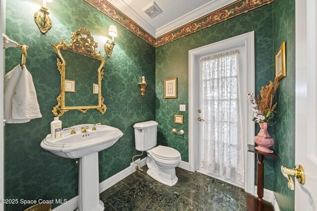 1407 Rockledge Dr, Rockledge, FL 32955 - bathroom with toilet and crown molding