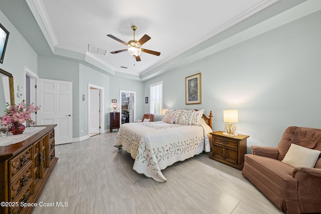 1407 Rockledge Dr, Rockledge, FL 32955 - bedroom with a raised ceiling, ceiling fan, crown molding, and light wood-style floors