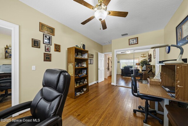 1407 Rockledge Dr, Rockledge, FL 32955 - office area with a ceiling fan, wood finished floors, and a textured ceiling