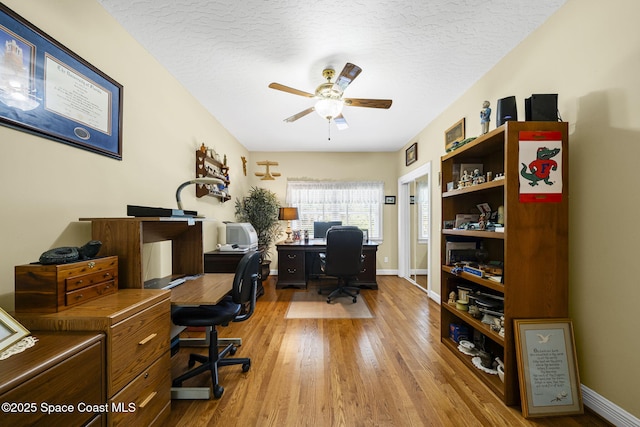 1407 Rockledge Dr, Rockledge, FL 32955 - home office featuring ceiling fan, wood finished floors, and a textured ceiling