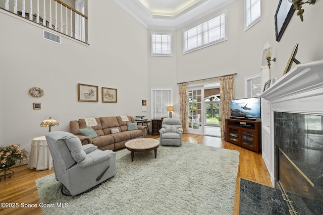 1407 Rockledge Dr, Rockledge, FL 32955 - living area featuring wood finished floors, ornamental molding, and a high ceiling