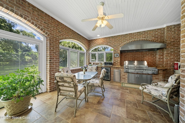 1407 Rockledge Dr, Rockledge, FL 32955 - sunroom featuring wine cooler, brick wall, stone tile flooring, and crown molding