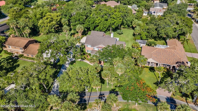 1407 Rockledge Dr, Rockledge, FL 32955 - aerial overview of property's location with nearby suburban area and a tree filled landscape