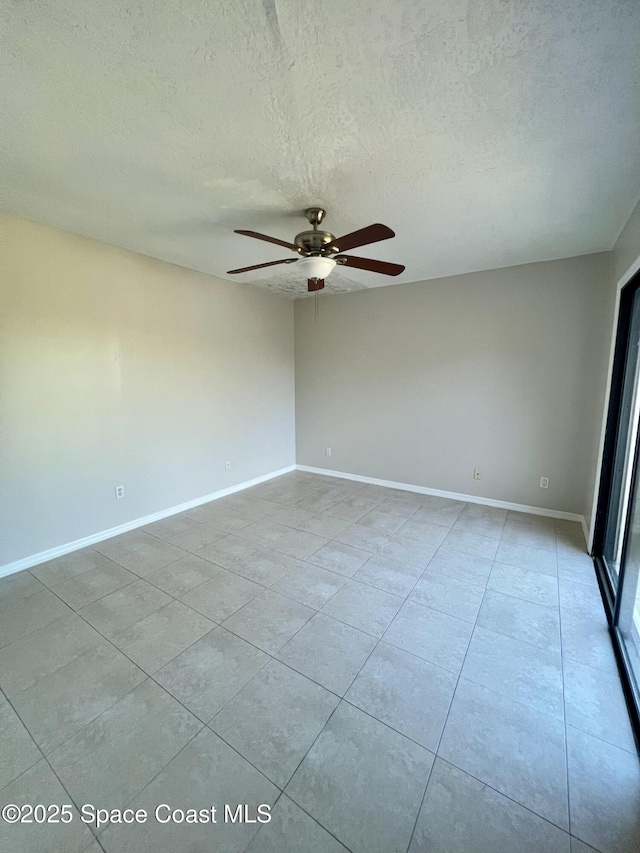 1917 Vista Oaks Cir NE, Palm Bay, FL 32905 - spare room featuring ceiling fan, light tile patterned floors, and a textured ceiling