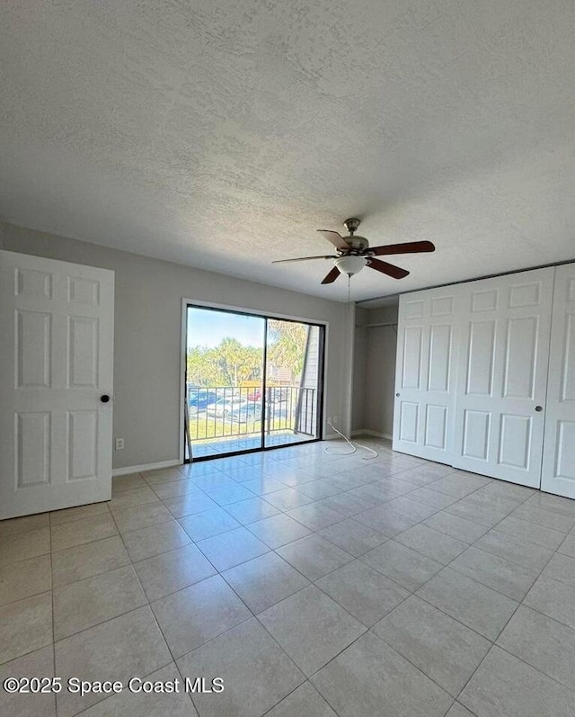 1917 Vista Oaks Cir NE, Palm Bay, FL 32905 - spare room with a ceiling fan, light tile patterned flooring, and a textured ceiling